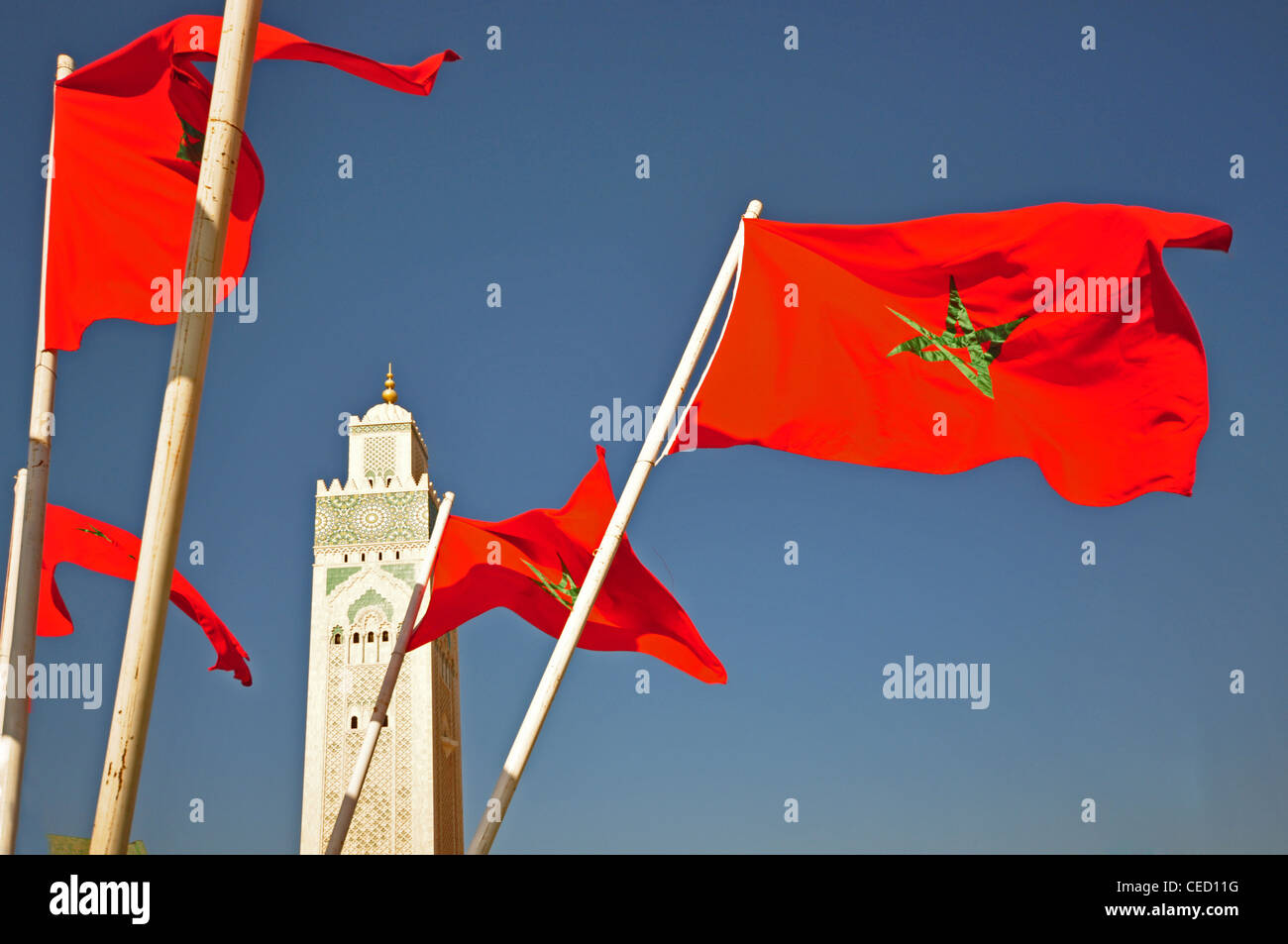 NORTH AFRICA, MOROCCO, Casablanca, Great Mosque Hassan II (1993), Islamic, with Moroccan flags on roundabout Stock Photo