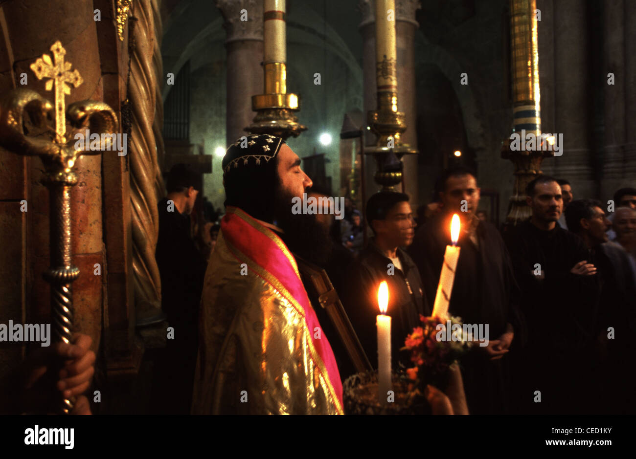 A Syrian Orthodox priest taking part in the Ceremony of the Holy Fire at the Church of Holy Sepulchre in the old city East Jerusalem Israel Stock Photo