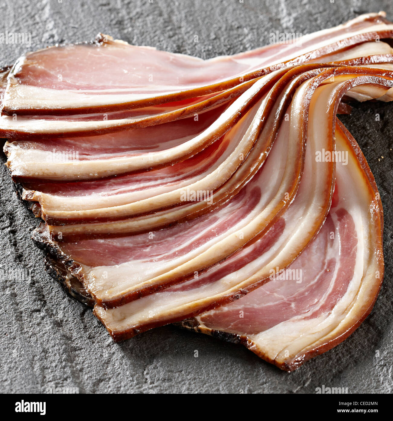 smoked bacon rashers fanning out Stock Photo