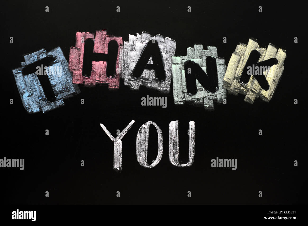 Thank you written in chalk on a blackboard Stock Photo Alamy