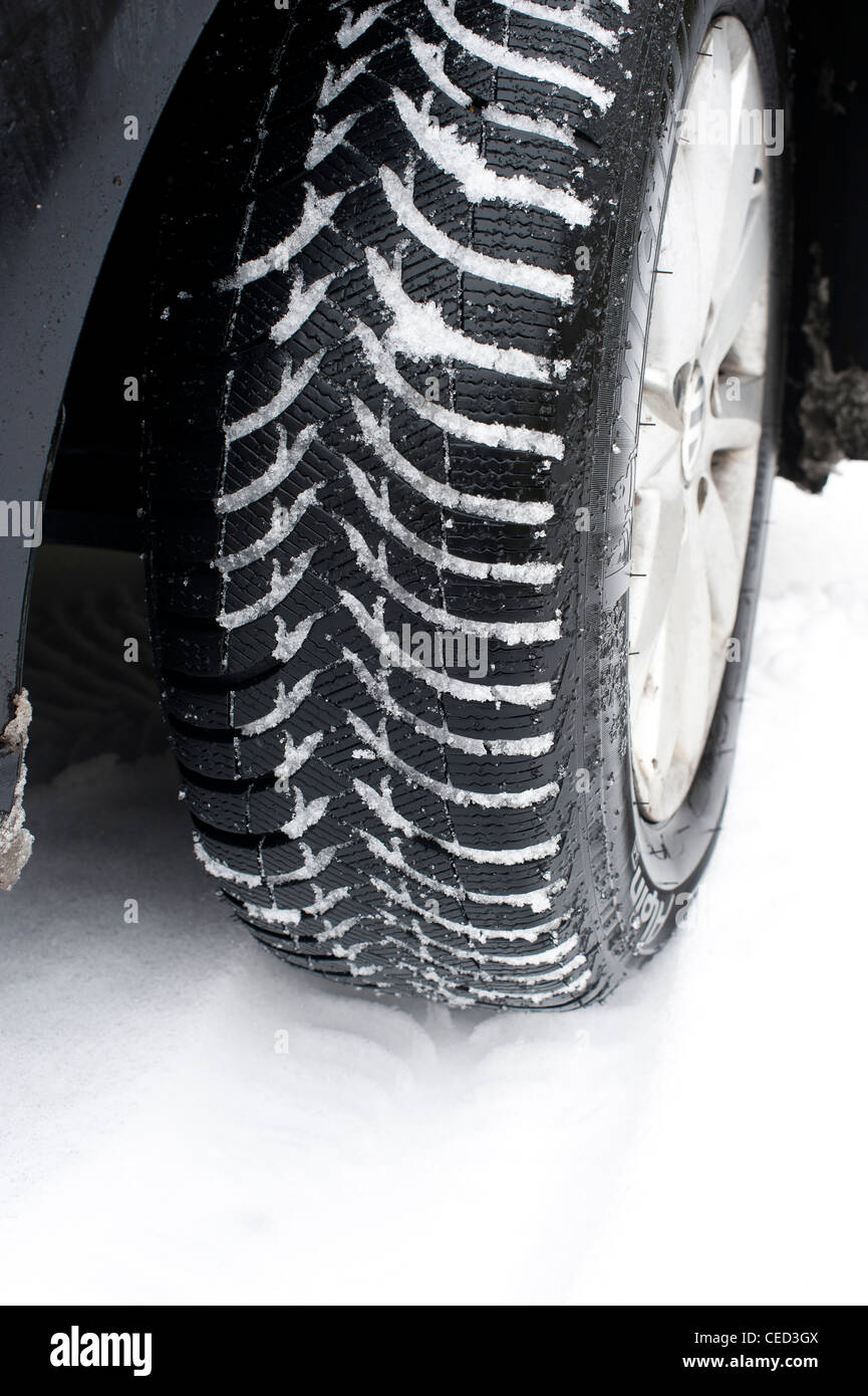 Michelin winter tyre in snow on a VW Golf car Stock Photo - Alamy