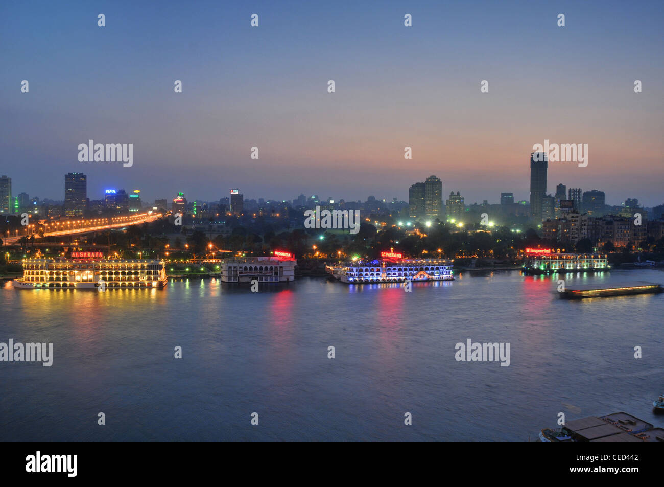 A central Cairo panorama looking west across the Nile River at dusk ...