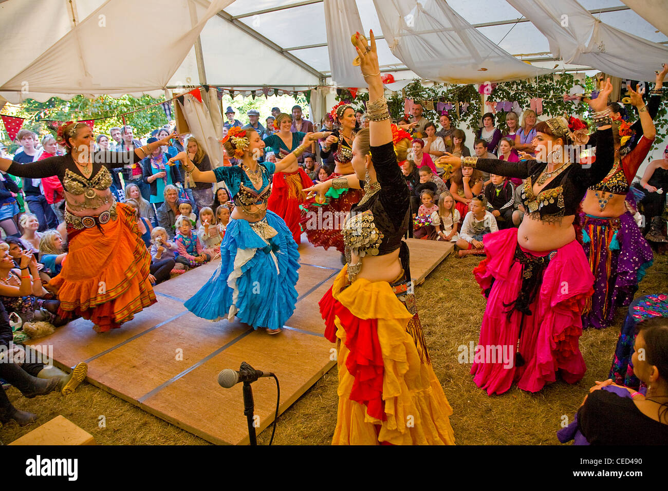 belly dancers performing to audience at Aeon festival Stock Photo