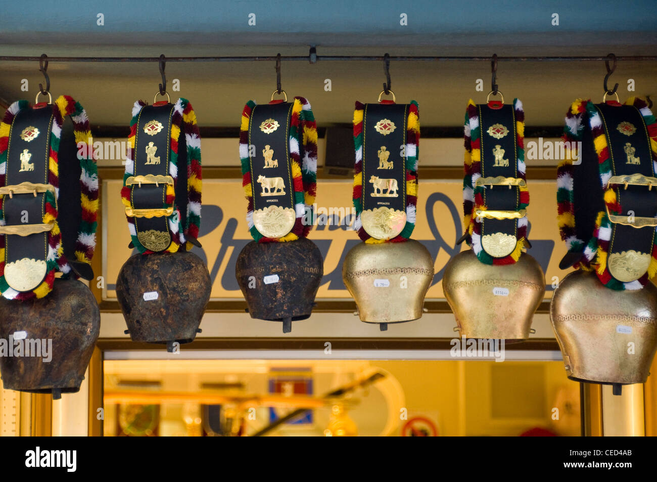 Horizontal close up of an array of various traditional cow bells aka