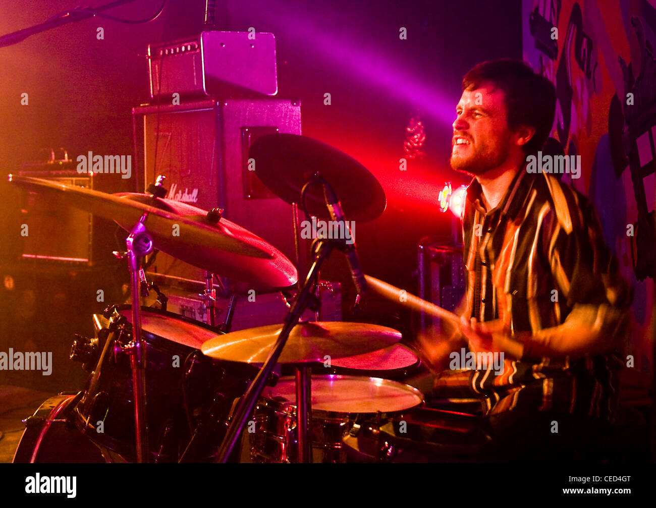 colourful-energetic-jazz-rock-drummer-playing-live-on-stage-stock-photo