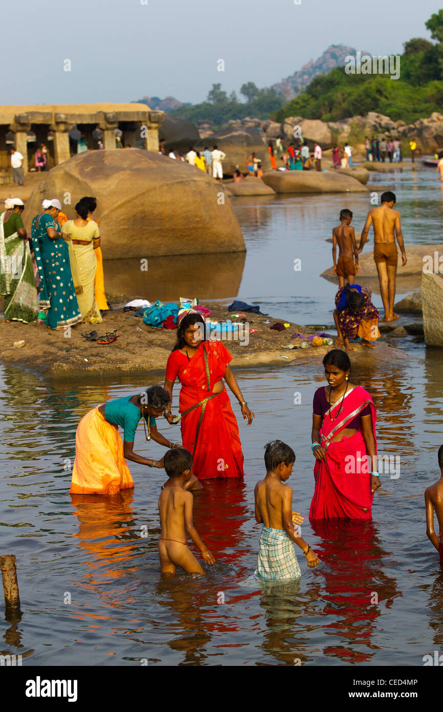 Activities at Tungabhadra river, people bathing in the river, early in the morning, Hampi, Karnataka, India Stock Photo