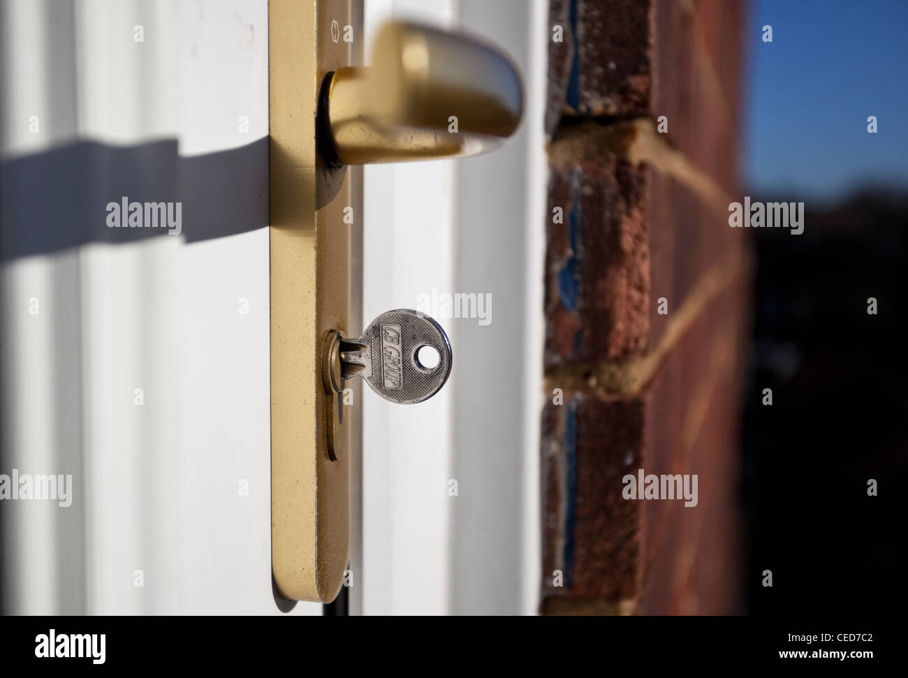 Key inserted in keyhole of a door lock Stock Photo Alamy