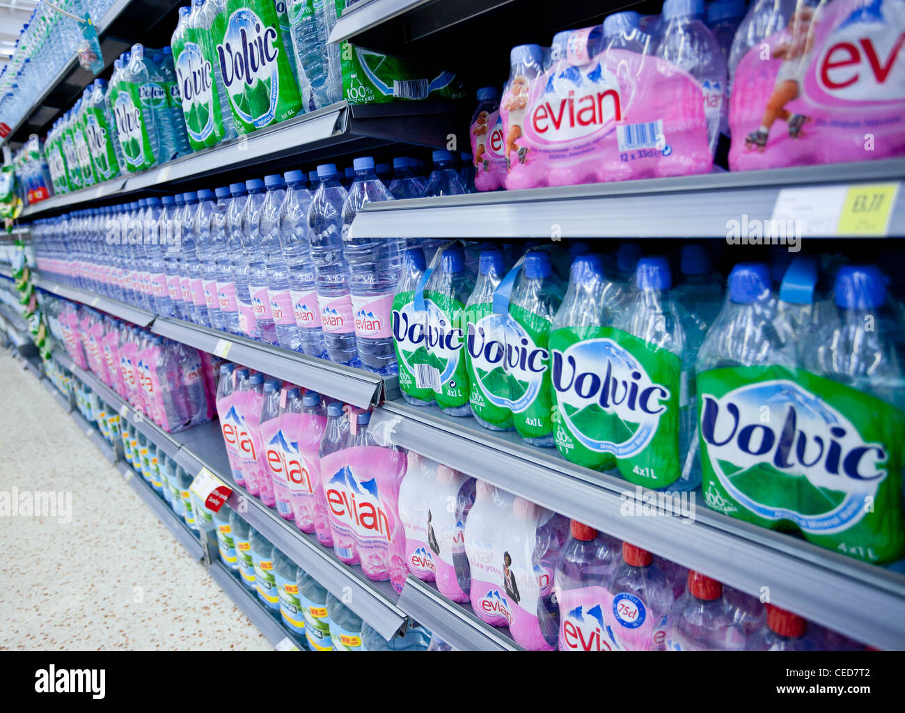 shelves with bottles of water for sale, England, Uk Stock Photo