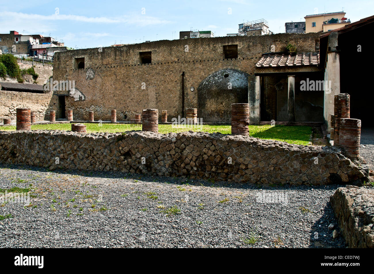 Open air courtyard outside an entrance to the Central Baths which served as a meeting place and recreational area, Herculaneum Stock Photo