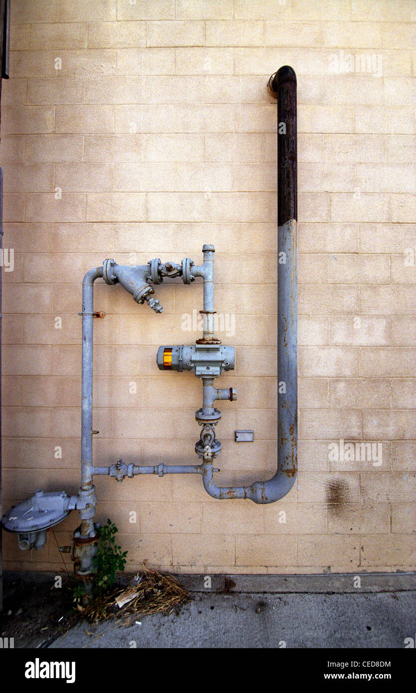Pipes in an alleyway. Stock Photo