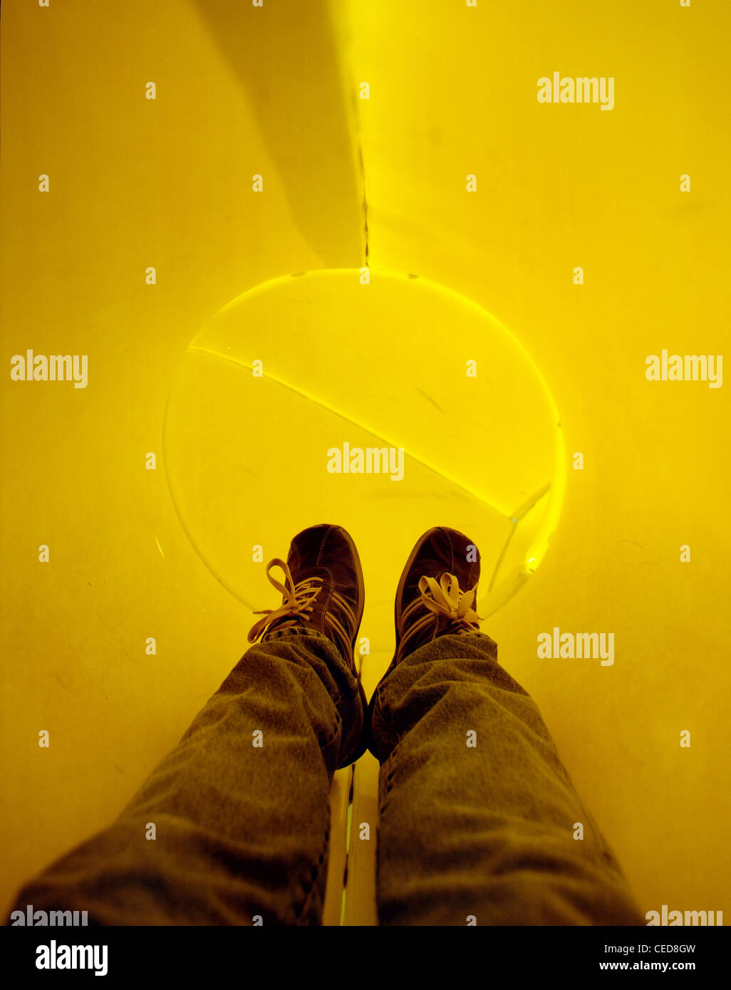 POV shot of a man entering an enclosed childrens' slide. Stock Photo