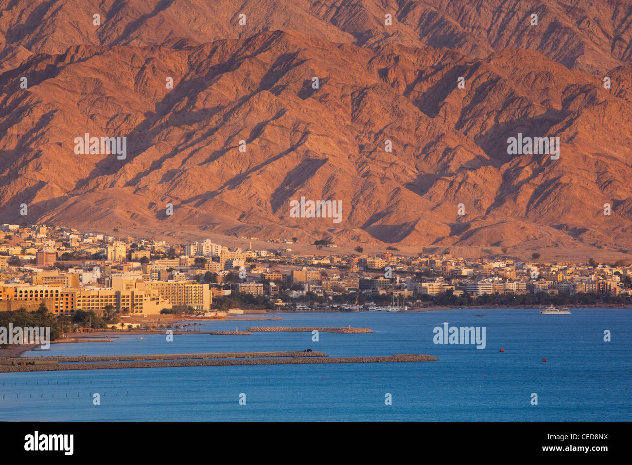 Israel, The Negev, Eilat, Red Sea beachfront, sunset view towards Aqaba, Stock Photo Alamy