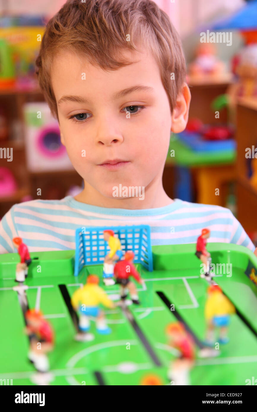 Boy plays in toy football Stock Photo Alamy