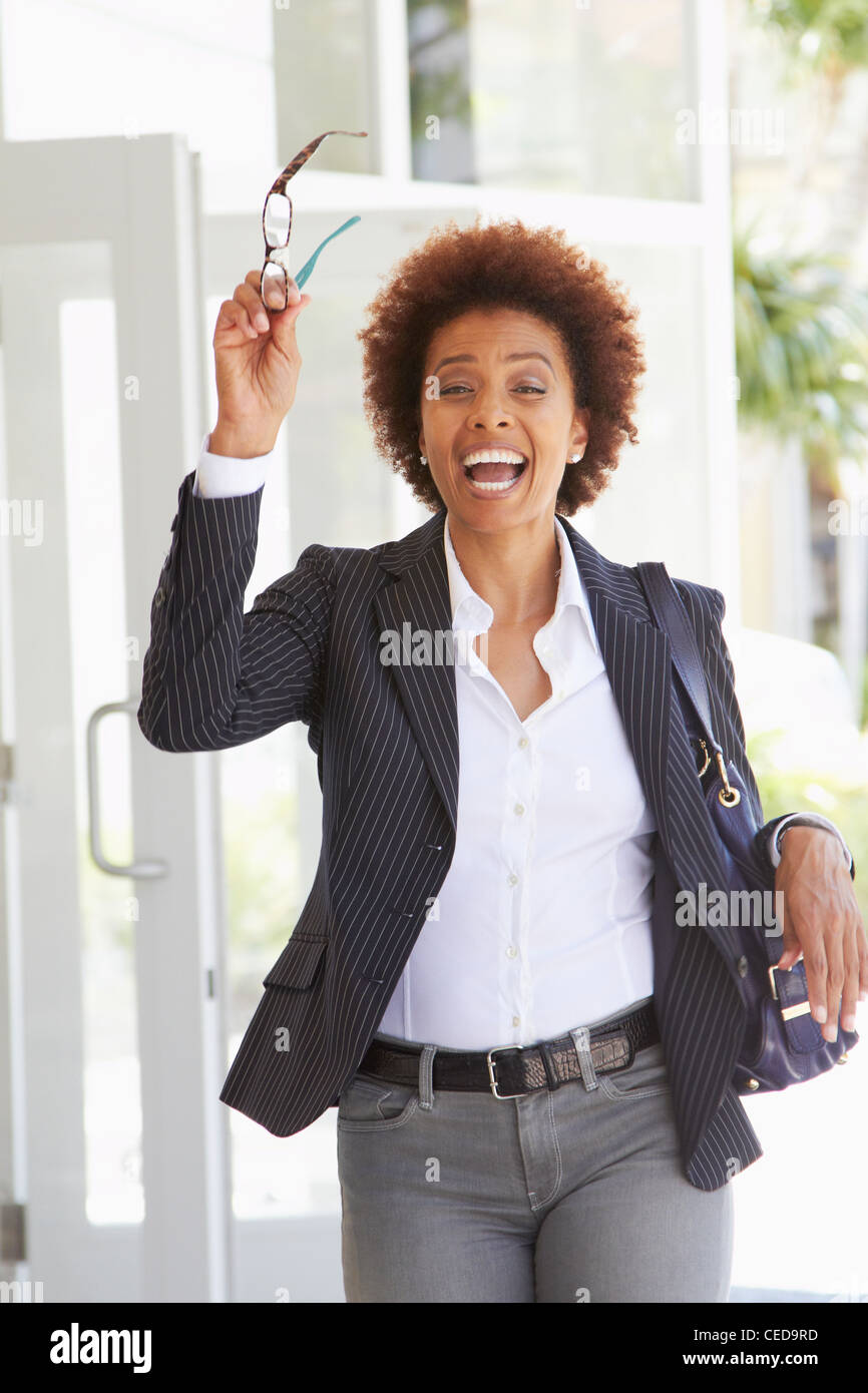 African American woman with arms raised outdoors Stock Photo - Alamy