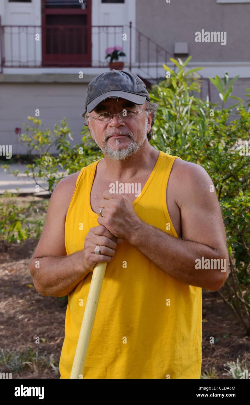 landscaper taking a break in a lawn. Stock Photo