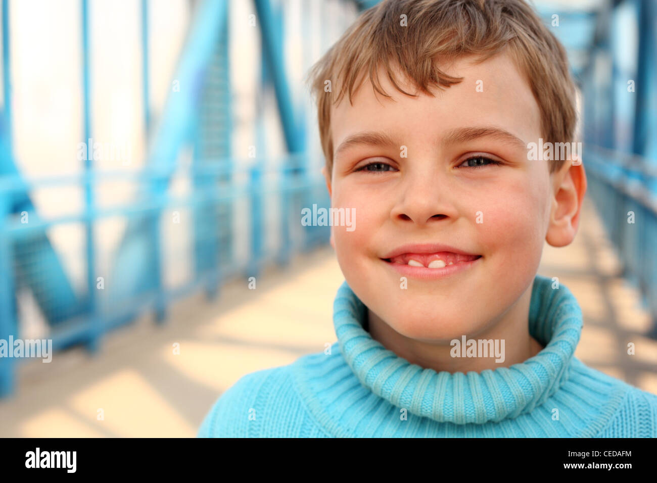 Smiling boy on bridge Stock Photo - Alamy