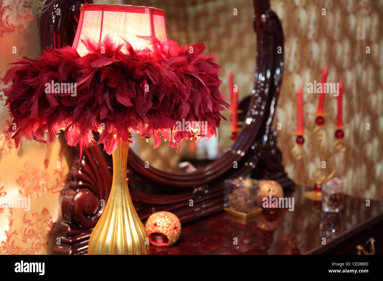 lamp in feathers on toilet table Stock Photo