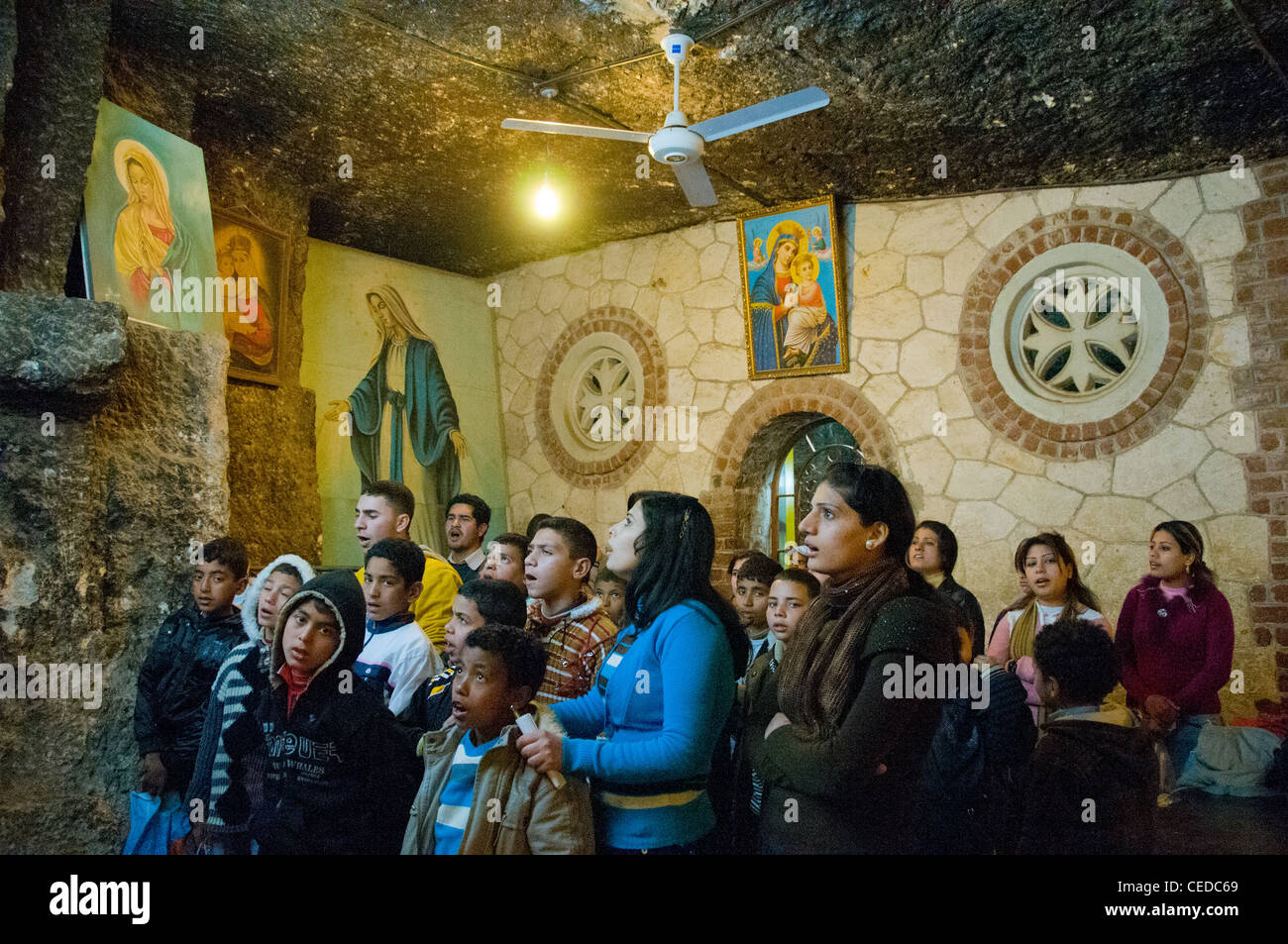 Young Coptic people praying at The Coptic Monastery in in Assiut Egypt Stock Photo