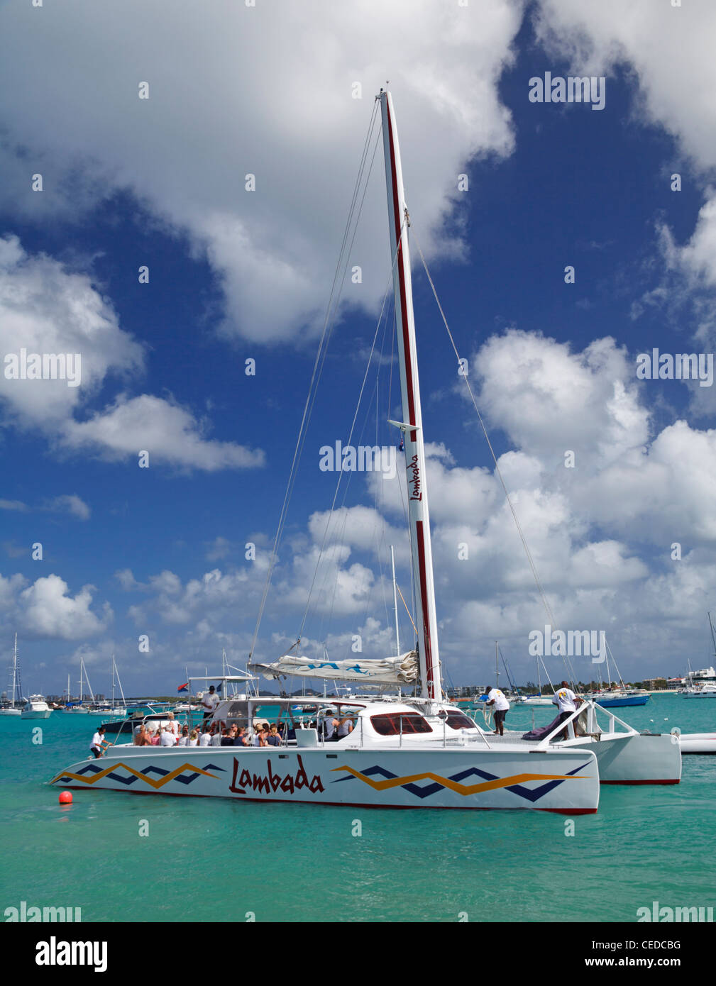 Tourists and crew aboard the Lombada in Simpson Bay before it embarks on tour Stock Photo