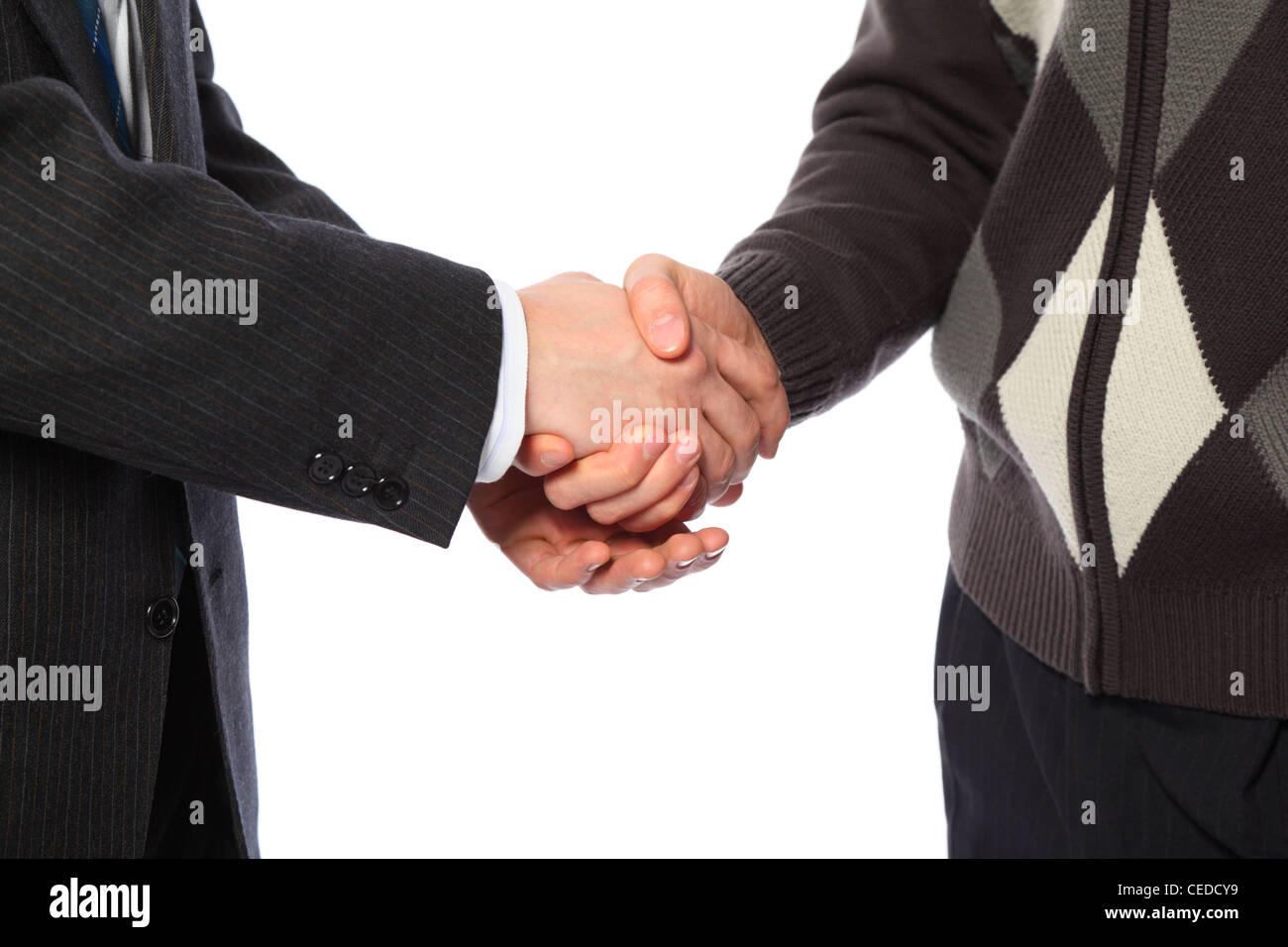 Handshake of two businessmen, suit and sweater Stock Photo