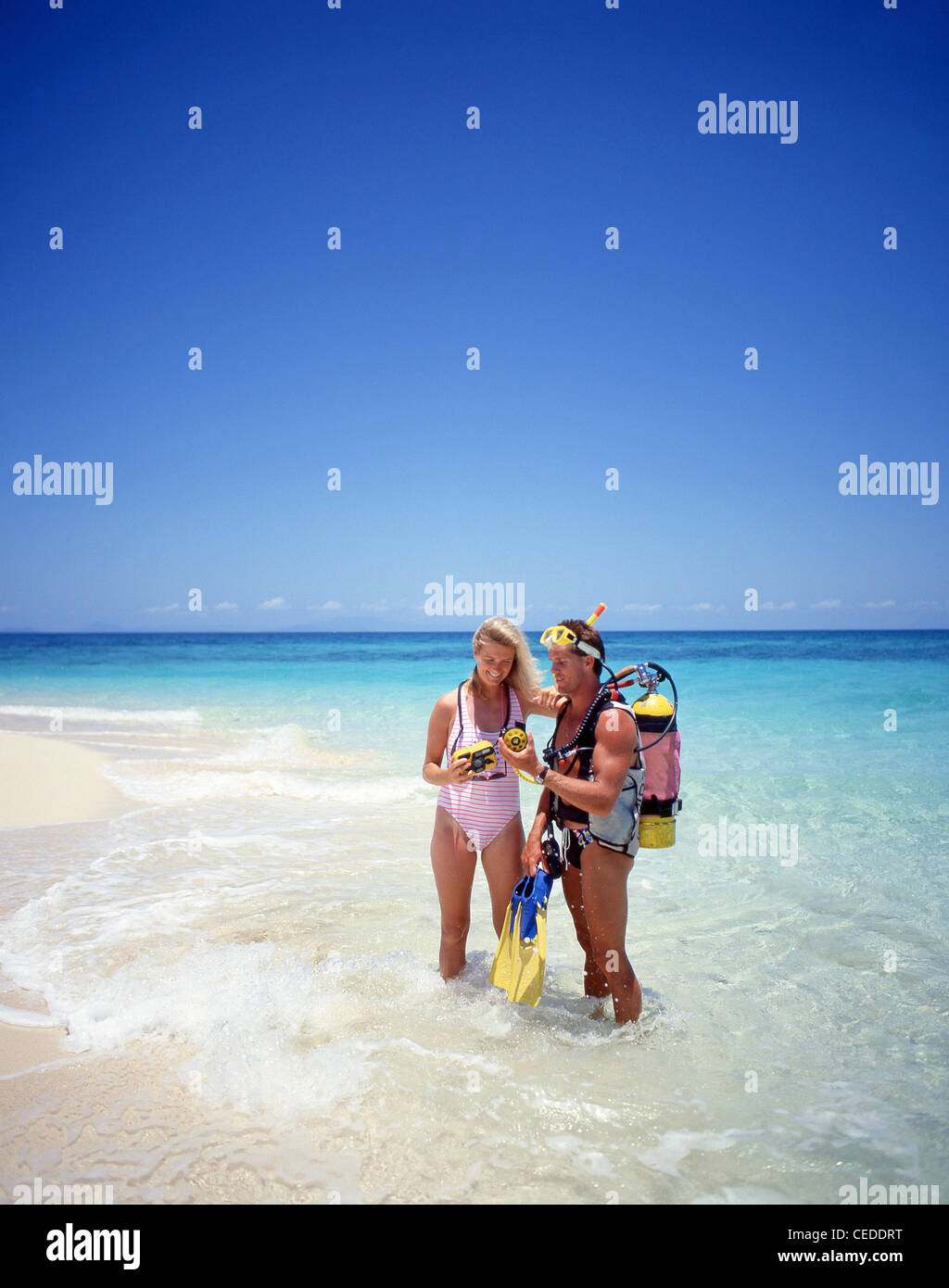 Couple scuba diving, Kuda Bandos, Kaafu Atoll, Republic of Maldives Stock Photo