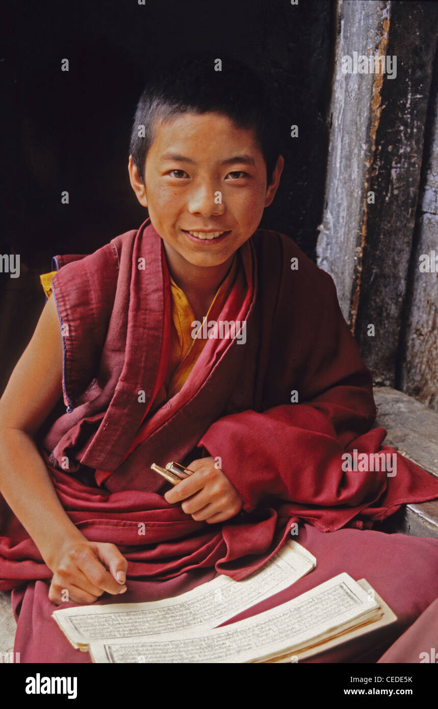 Drepung Monastery novice monk doing school work, Lhasa, Tibet Stock Photo