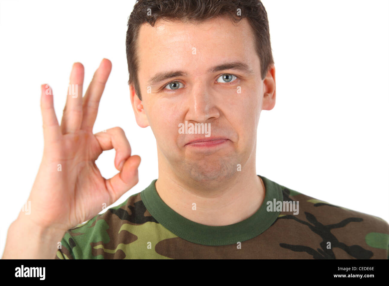 Man in camouflage shows gesture ok Stock Photo