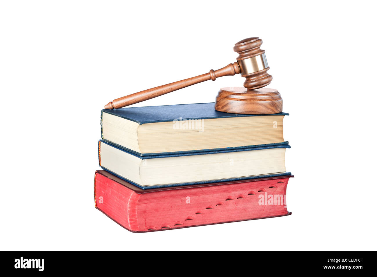 A gavel and sound block on thick legal reference books isolated on white. Stock Photo