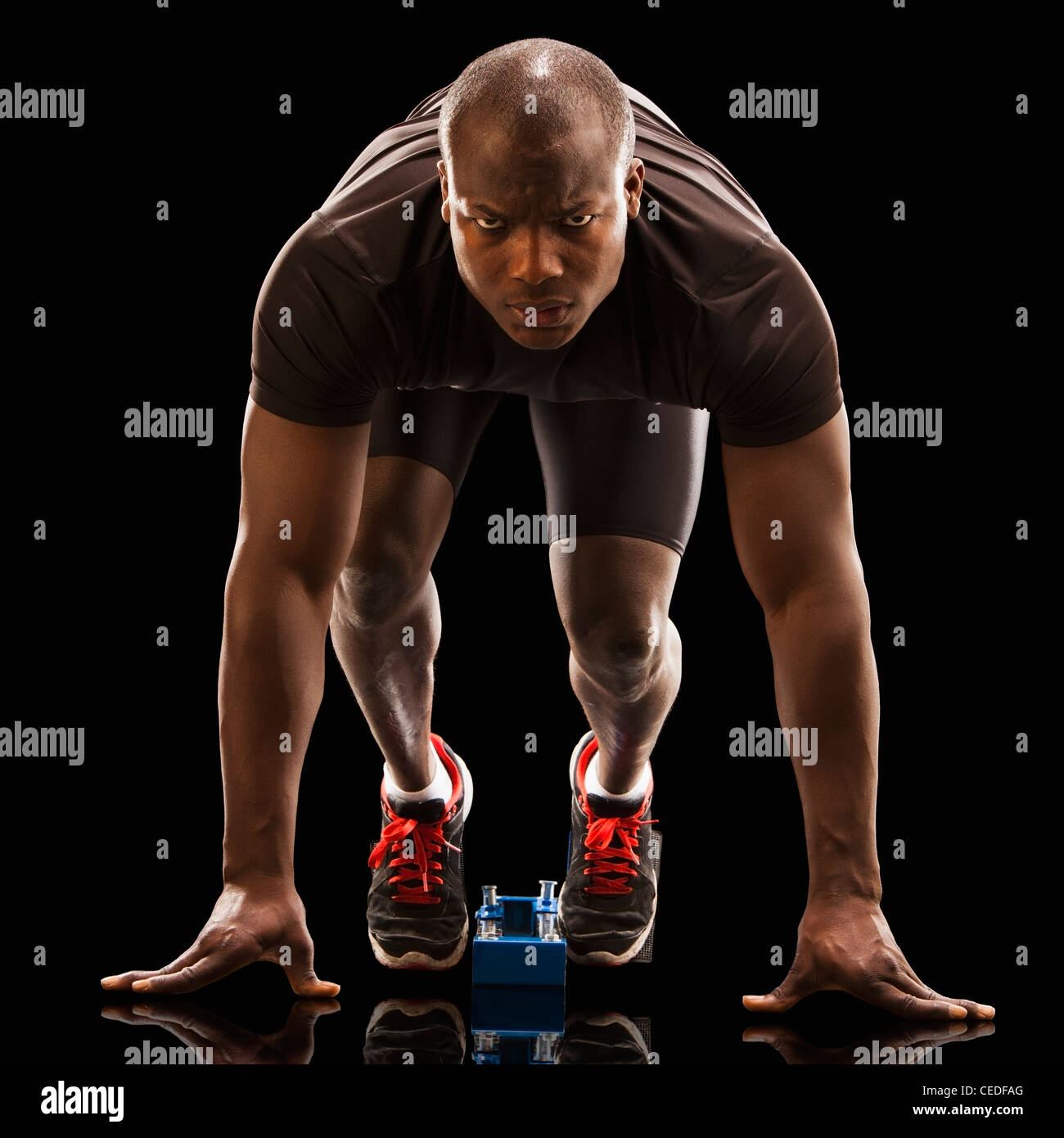 African American runner crouching at starting block Stock Photo - Alamy