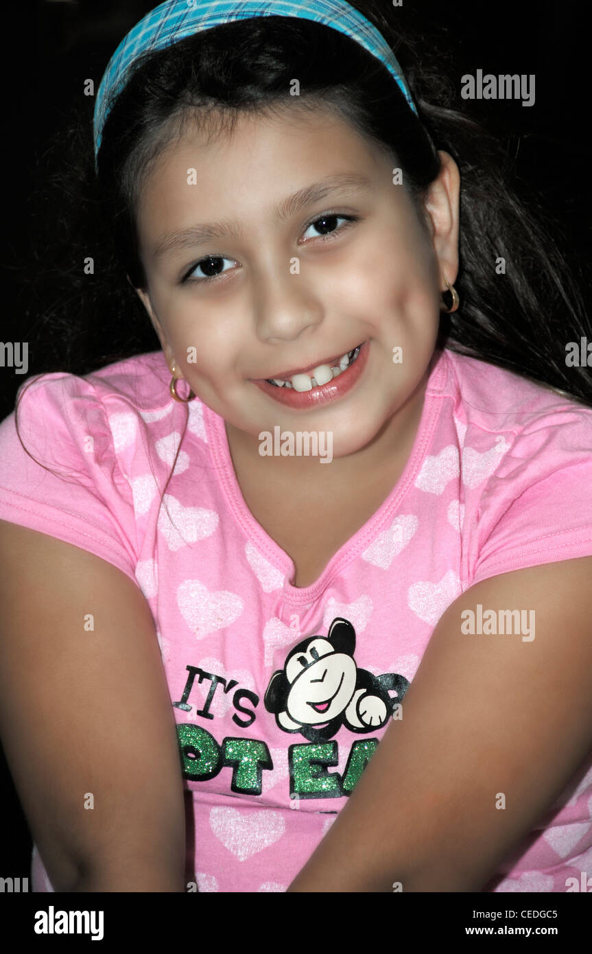 A young smiling Latin American Hispanic girl Stock Photo