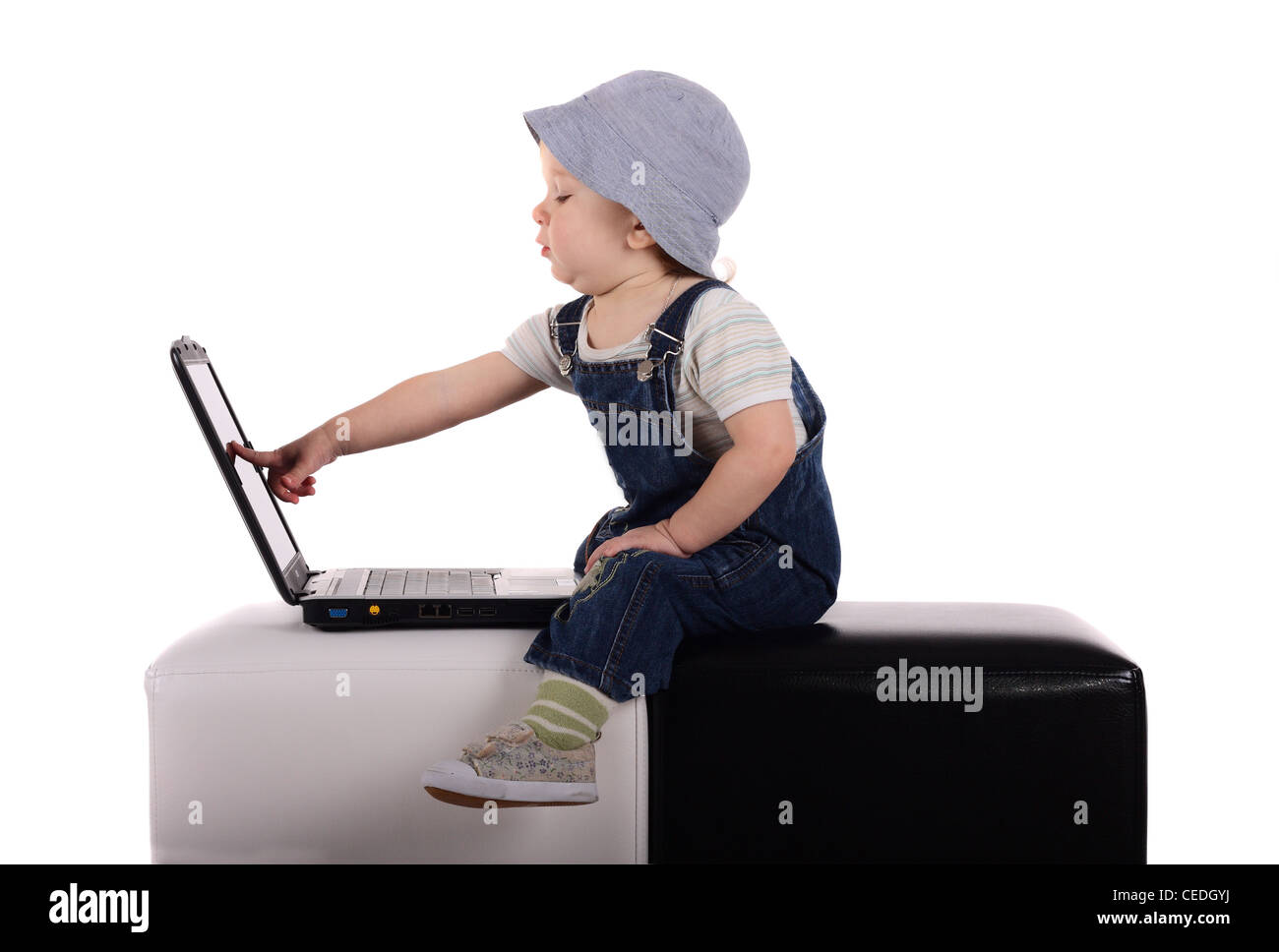 Little boy sitting with a laptop isolated on the white Stock Photo - Alamy