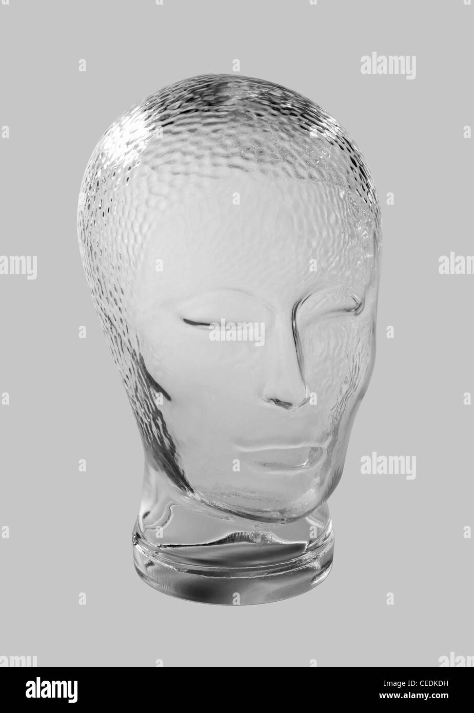 profile shot of a generic human 'dummy' head made of glass in gradient grey back, with clipping path Stock Photo