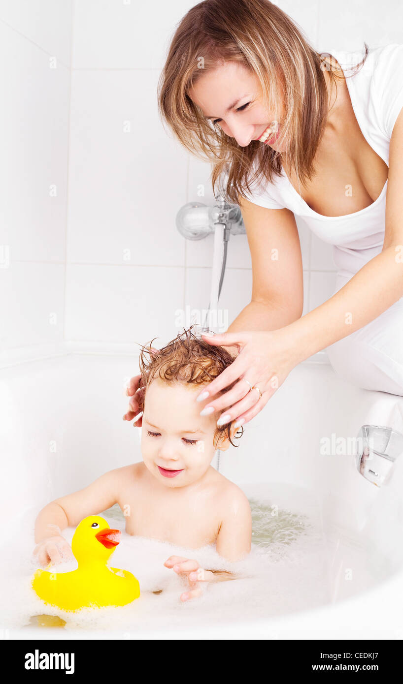 mother washing her baby in the bath Stock Photo Alamy