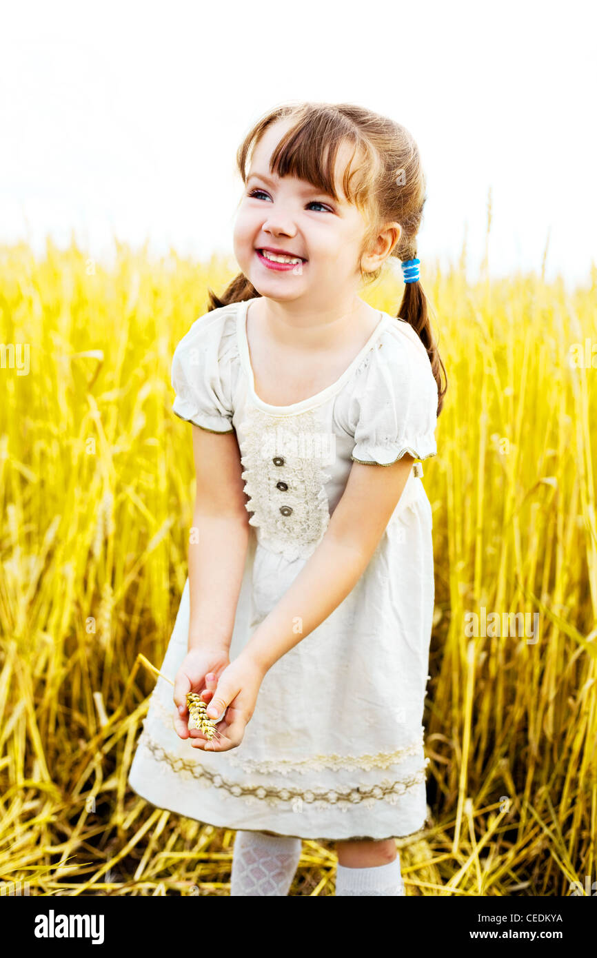 happy girl at the wheat field Stock Photo - Alamy