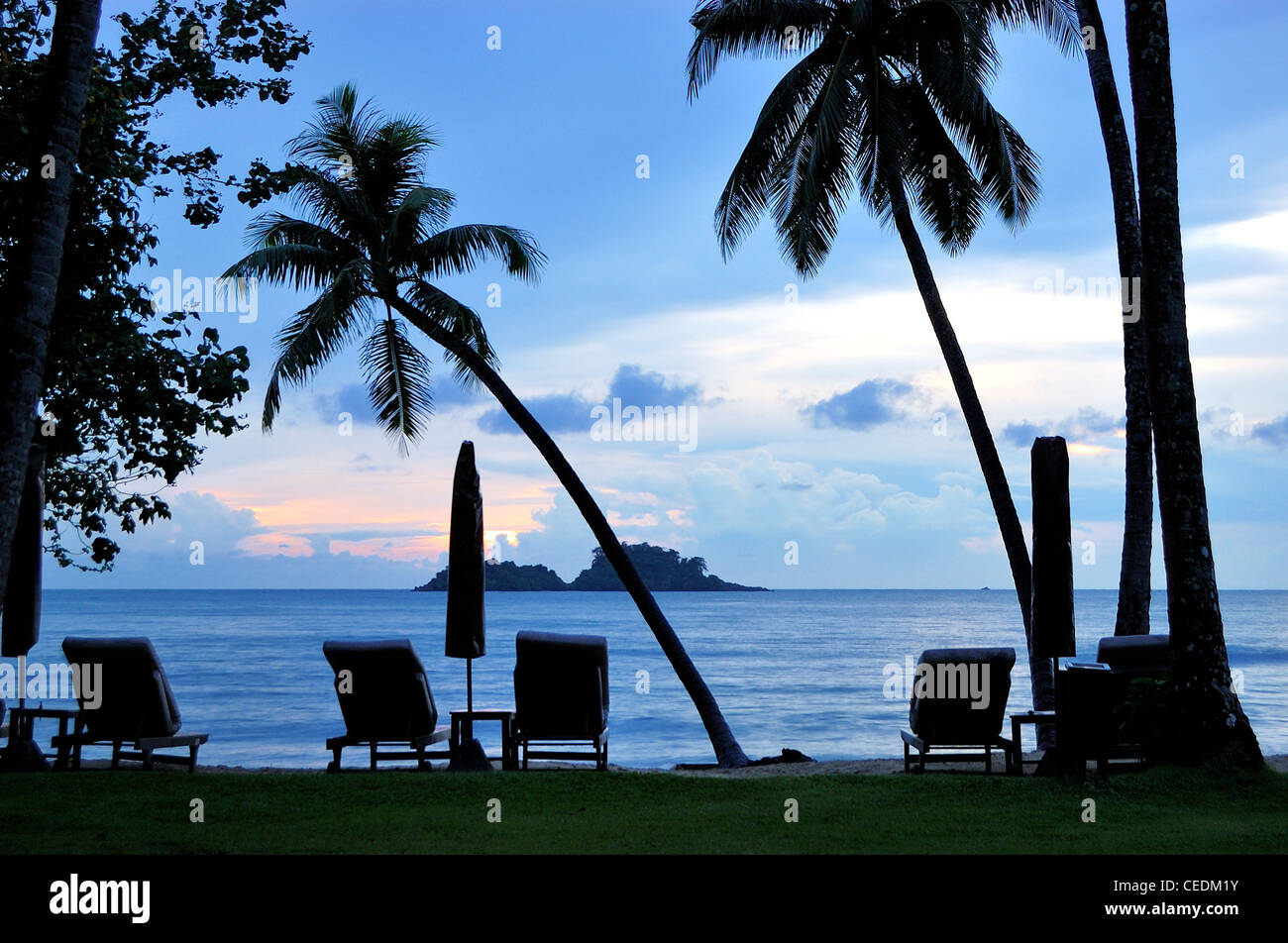 Beach during sunset with coconut palms, Koh Chang island, Thailand Stock Photo