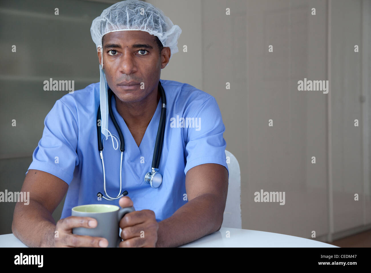Black doctor in scrubs and surgical cap Stock Photo Alamy
