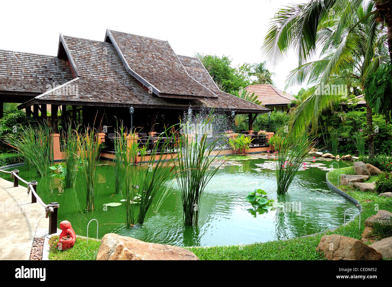 Outdoor restaurant and green pond at the luxury hotel, Samui island, Thailand Stock Photo
