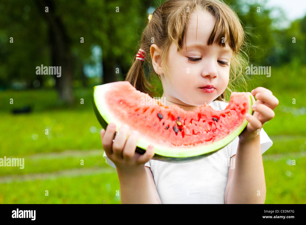 happy girl eating water melon Stock Photo