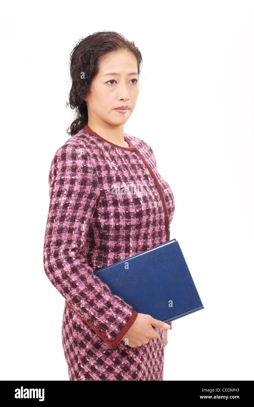 Asian businesswoman holding a book Stock Photo