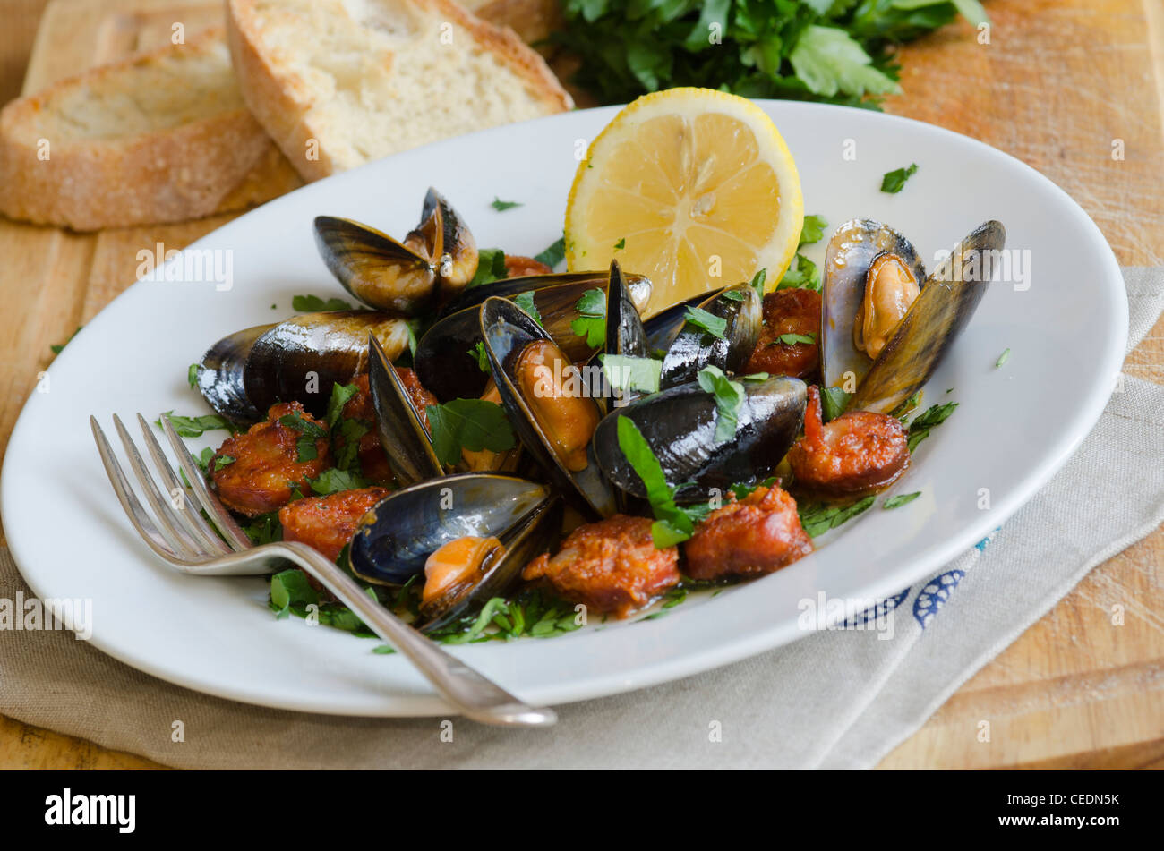 Mussels and Chorizo in white wine sauce Stock Photo Alamy