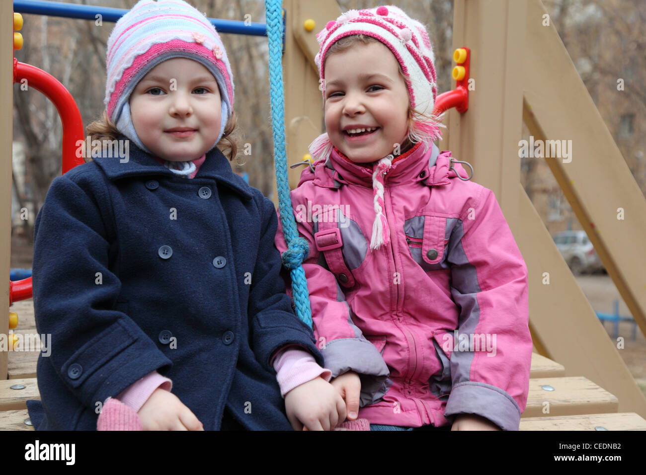 Two smiling girls on playground Stock Photo - Alamy