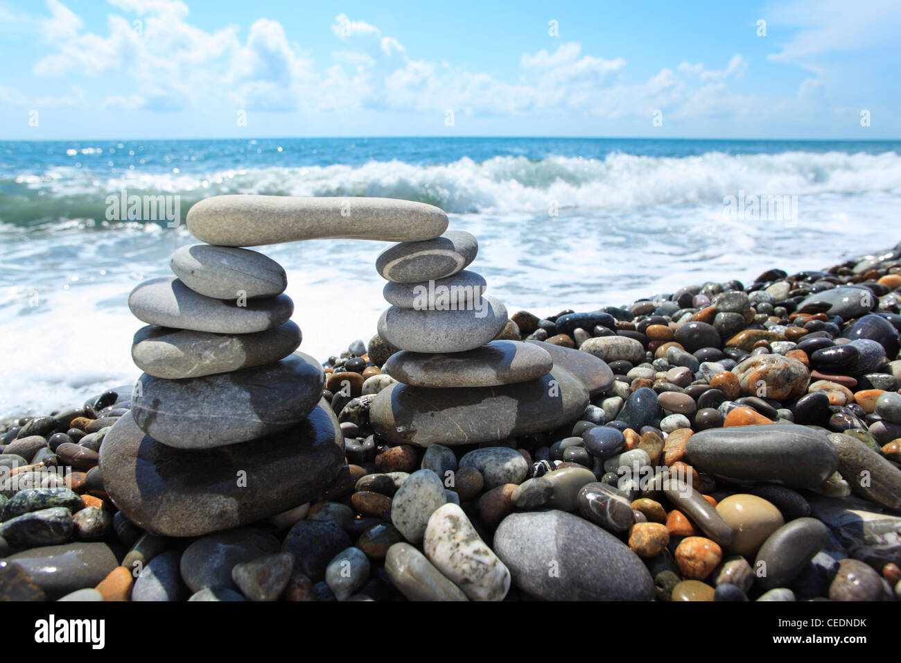 arch from pebble on seacoast Stock Photo