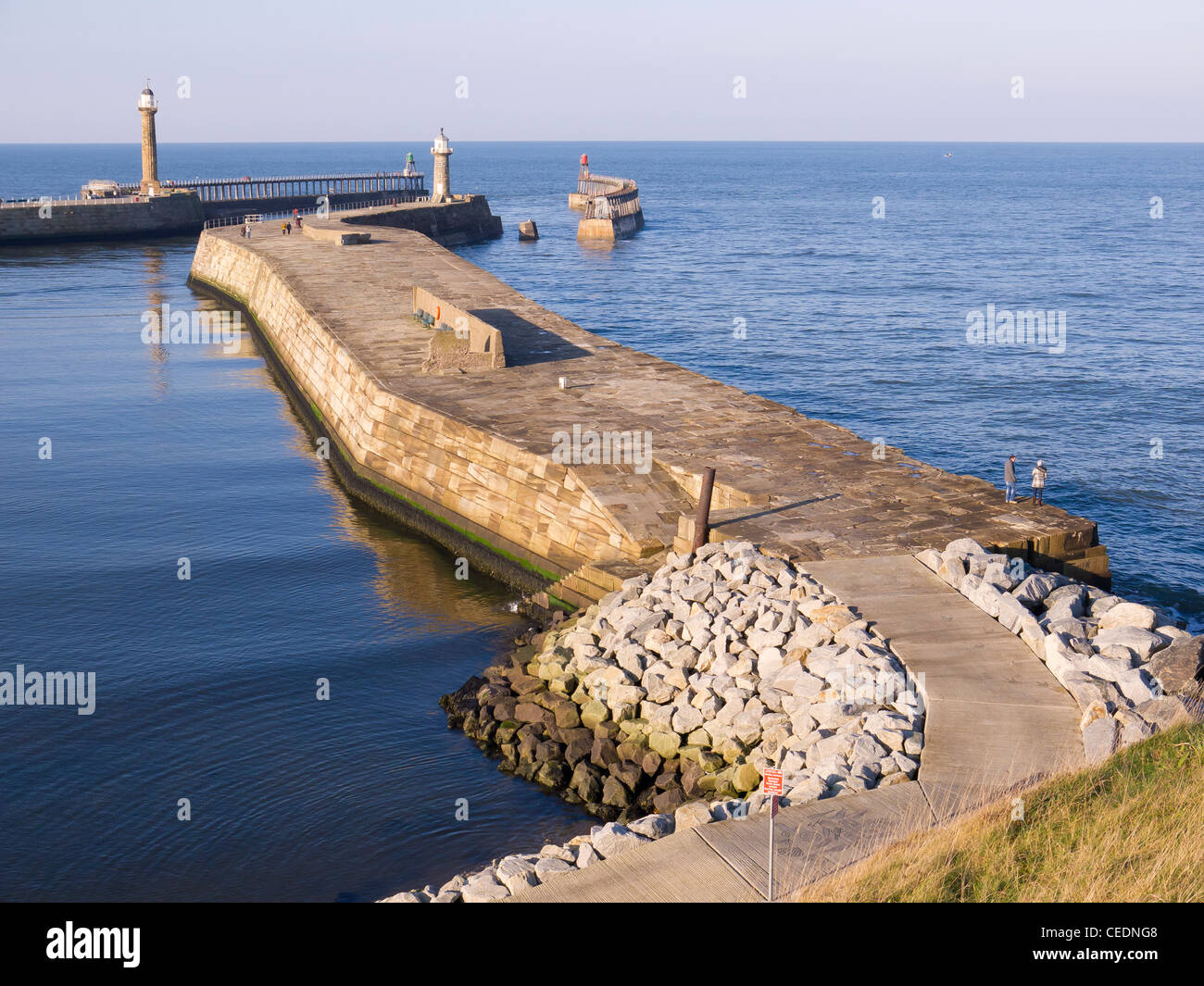 Whitby East Pier on a sunny winters day showing the rock armouring protection at the landward end completed 2001 Stock Photo