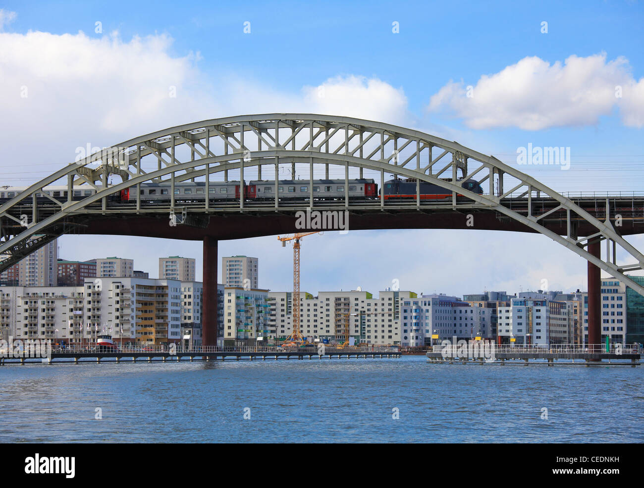 Railway Bridge with a train crossing over the water in Stockholm, capital of Sweden. Stock Photo