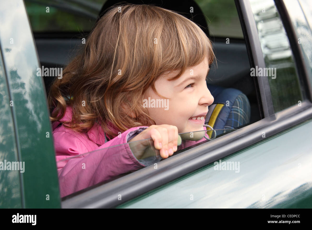 girl in the car looking throw window Stock Photo Alamy