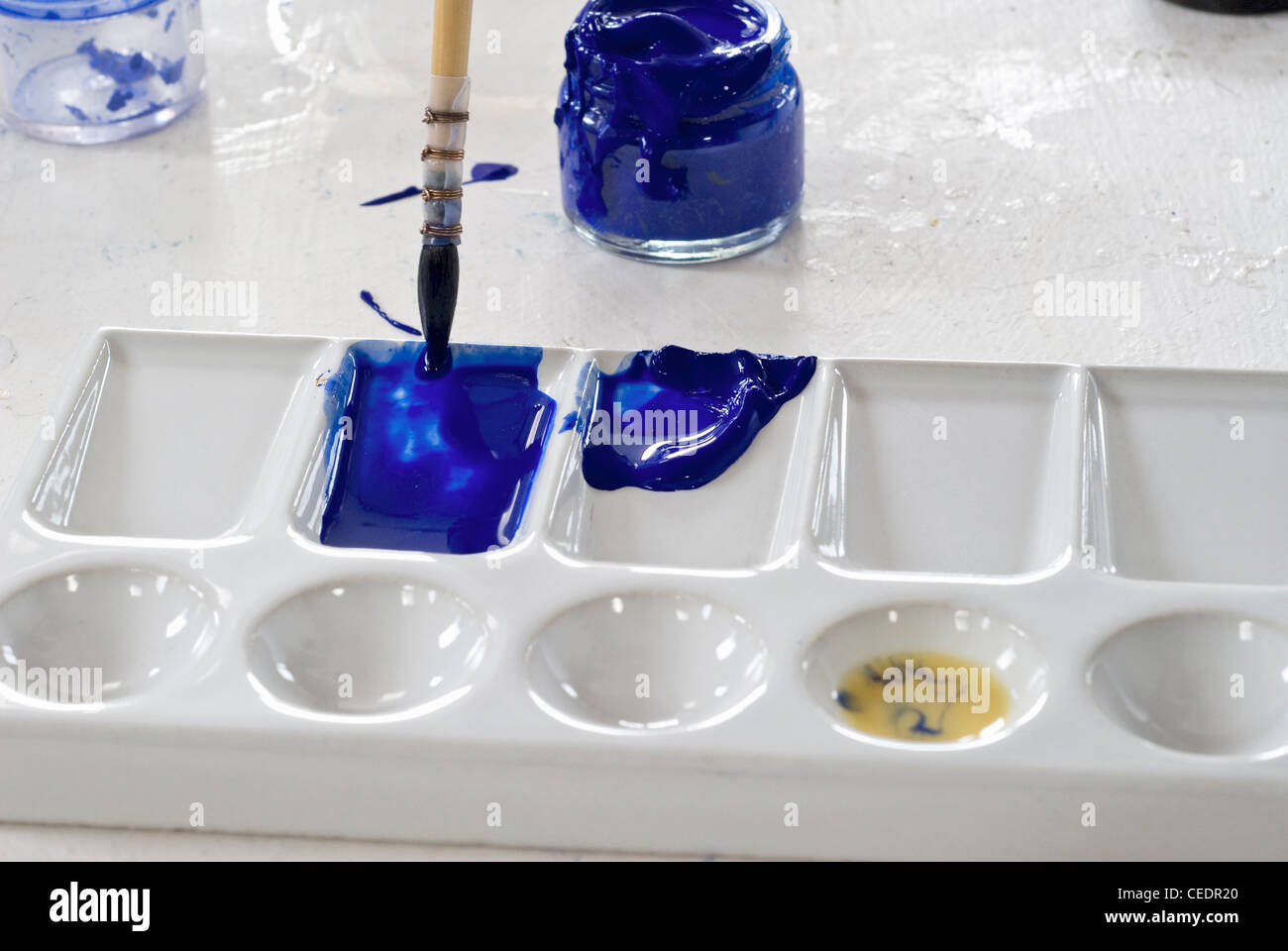 Mixing ultramarine pigment paste with egg yolk Stock Photo Alamy