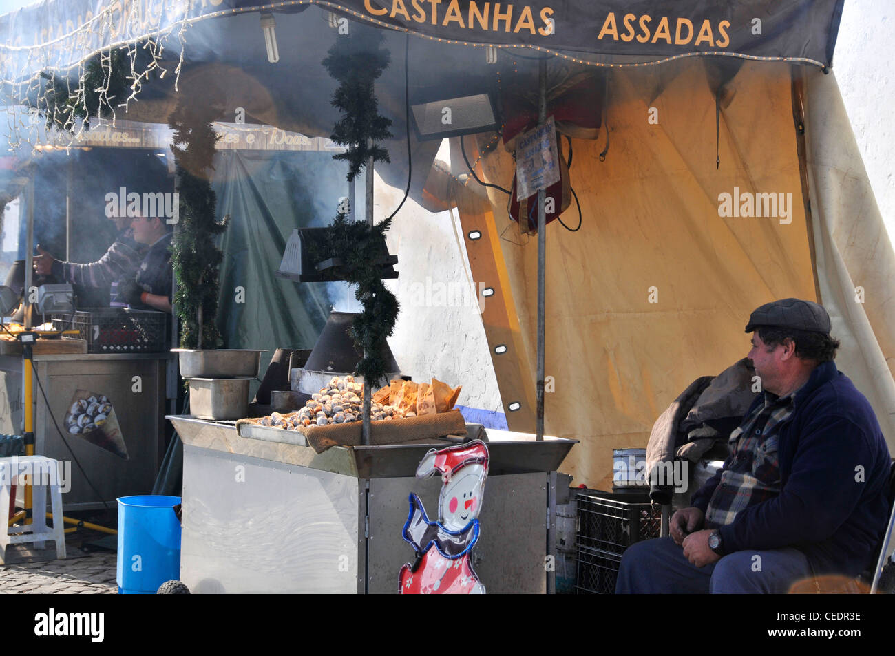 Castanhas Assadas (roasting chestnuts) stall, Obidos Portugal Stock Photo