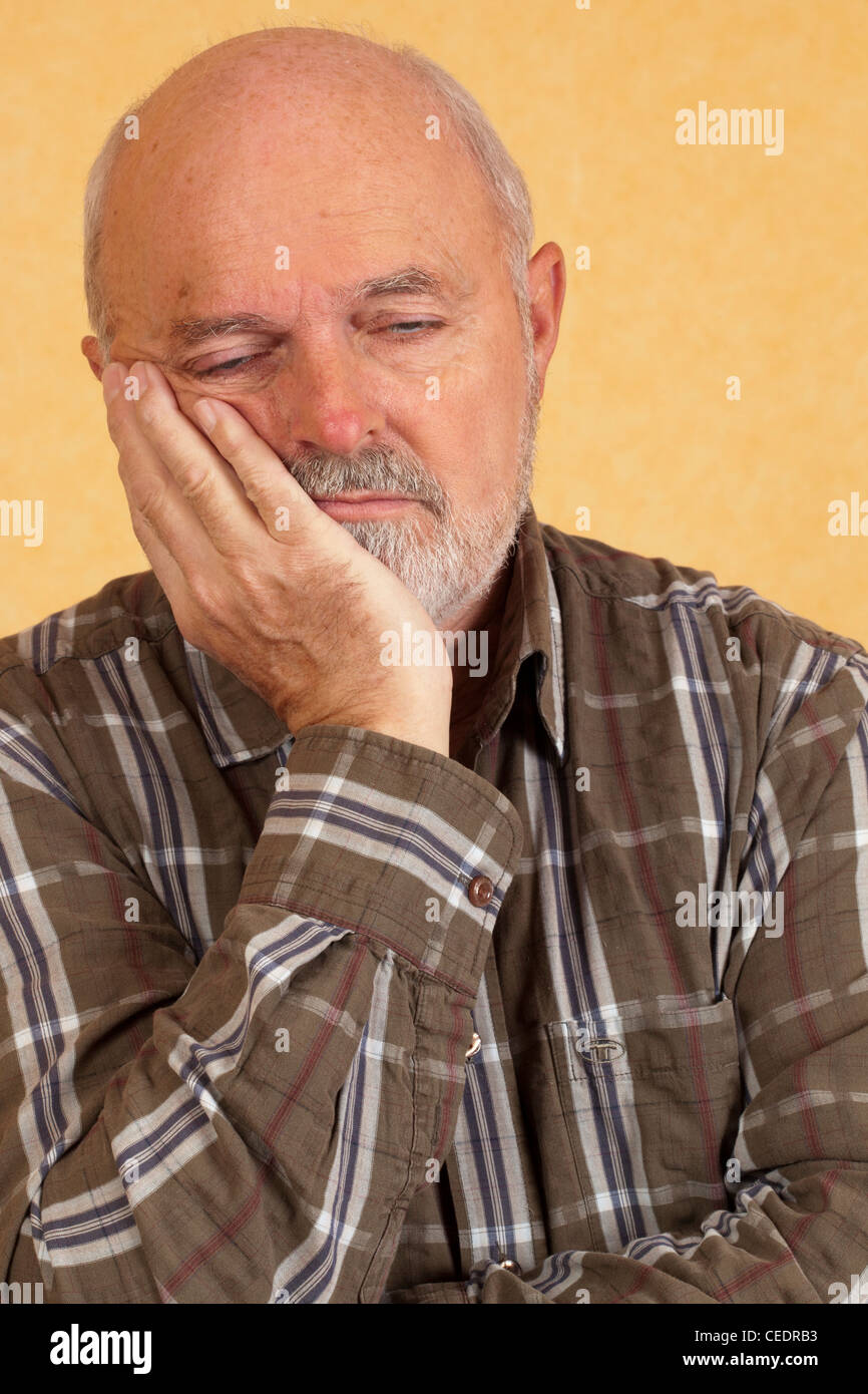Elderly man with closed eyes Stock Photo