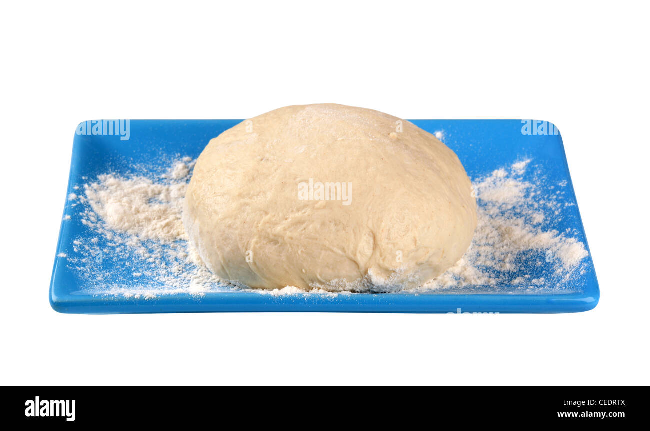 Raw dough on a blue plate Stock Photo