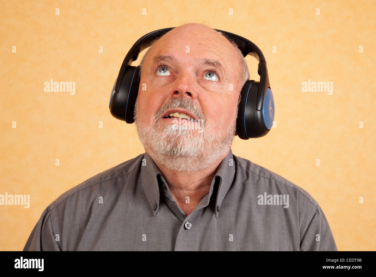 Elderly man with headphones Stock Photo